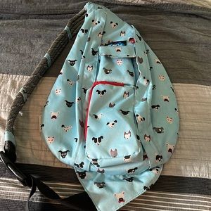 KAVU sling backpack w/rope straps. Dog face design. Lightly used